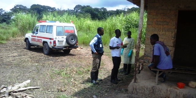Dr John Ekow Otoo (in blue) working in Kailahun which was the first district that recorded no new cases of Ebola in Sierra Leone.